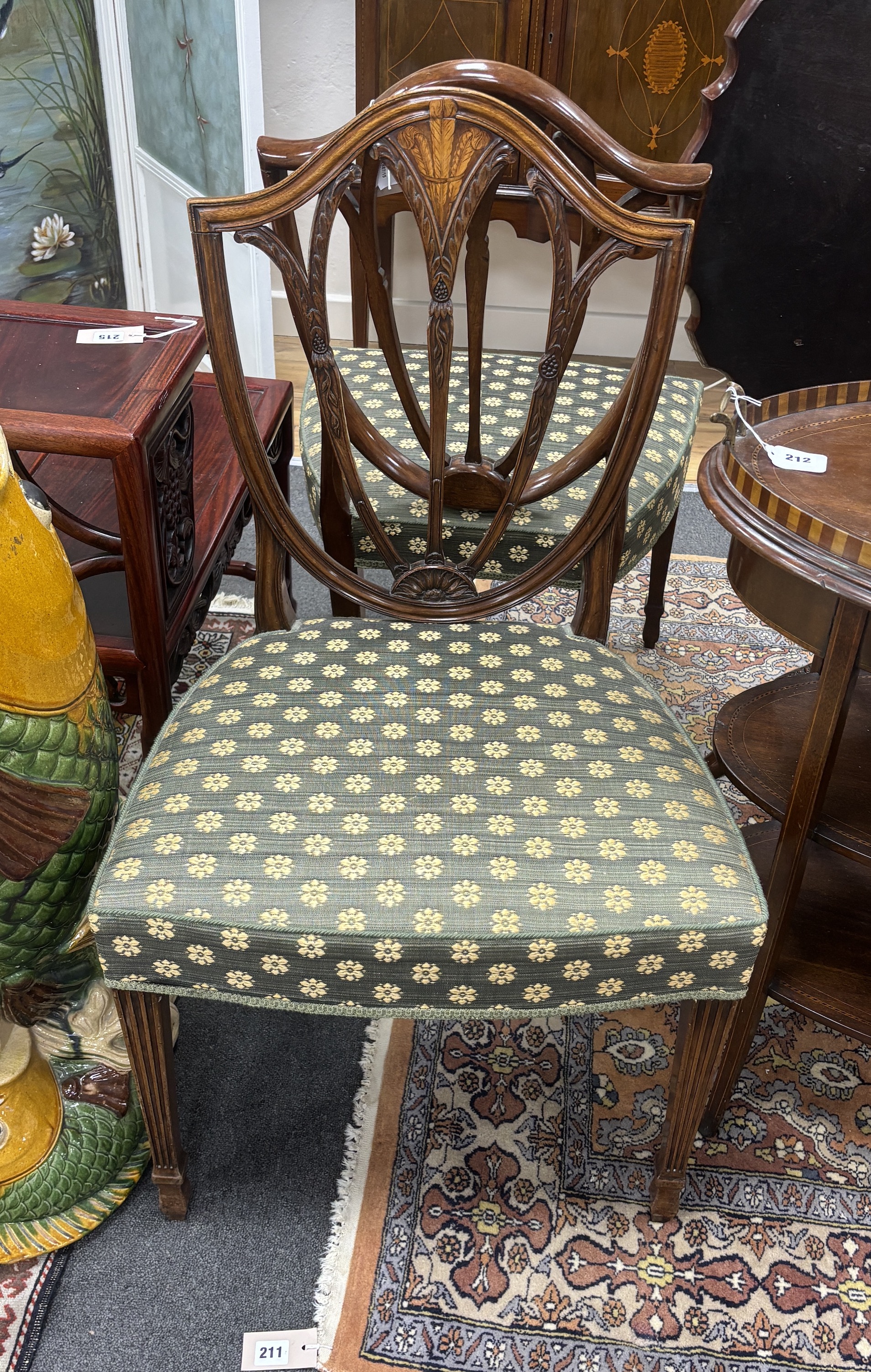 A pair of George III inlaid mahogany dining chairs